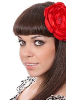 beautiful young brunette woman with an red fabric flower in her hair