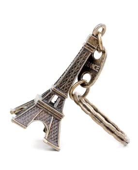 Small bronze copy of Eiffel Towers, isolated on white