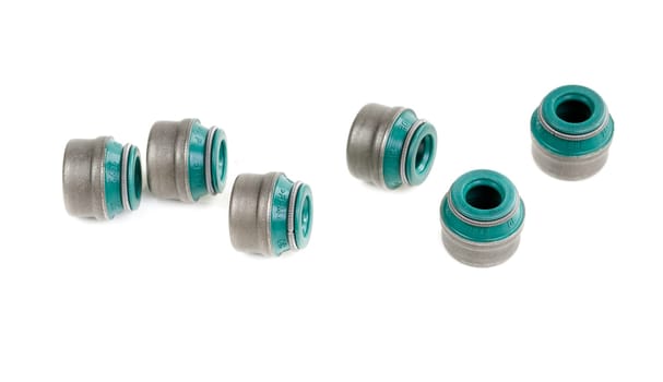 original green valve stem seals isolated on white background