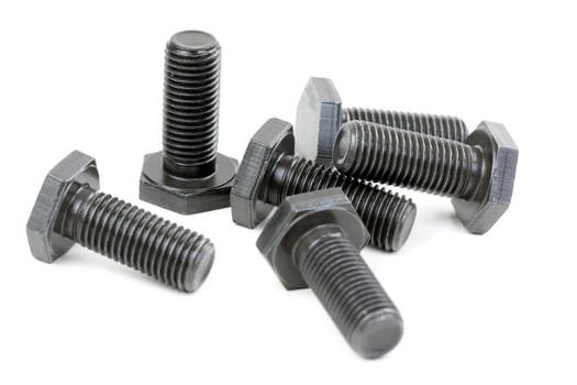 Bolts coated with protective varnish on a white background (heap)