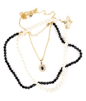 beads and chain with a pendant on a white background