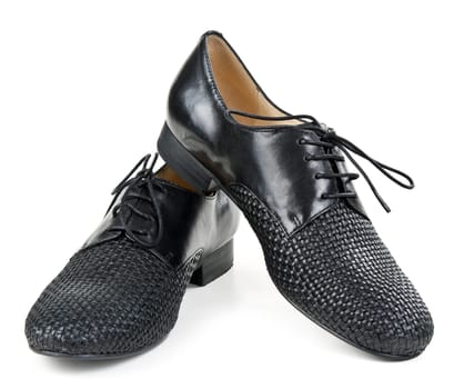 stylish pair of black leather shoes on a white background