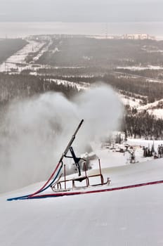 snow gun spray on the mountain snow