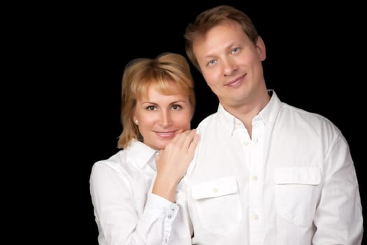 portrait of a beautiful couple on a black background