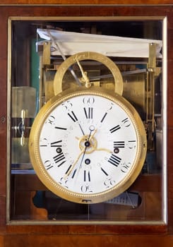 Antique Clock with Roman Numerals in wooden case