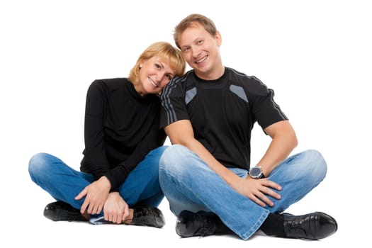 Beautiful couple in love sitting in the lotus position, isolate on white