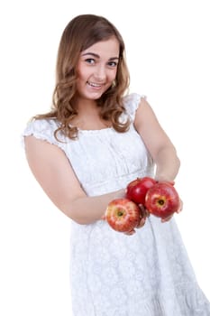 Beautiful young girl with three apples in their hands, isolate white