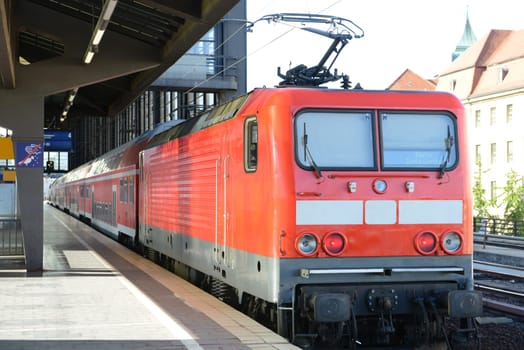 Train is waiting the passengers at the empty station in Berlin.