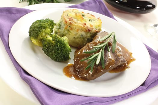 Venison steak with broccoli and potato gratin
