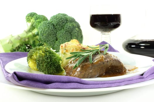 Venison steak with broccoli and potato gratin