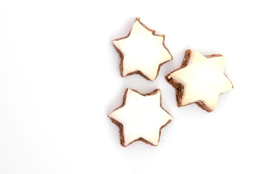 Three cinnamon stars on white background