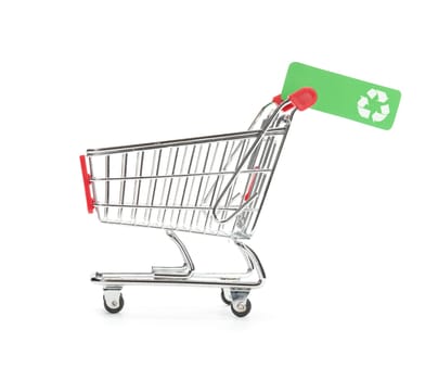 Green consumerism (bio, eco, recycling etc.) concept - shopping cart with green label with recycling sign.