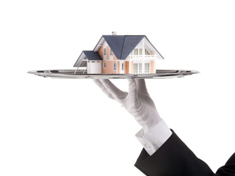 Offer of house concept (real estate). Waiter is having model of the house on tray.