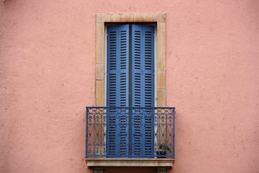 pink wall and blue balcony from old times