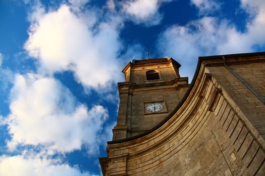 Chapel that bells every hour, photographed with blue sky