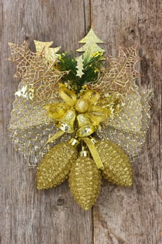 Golden christmas decoration hang on the wooden wall