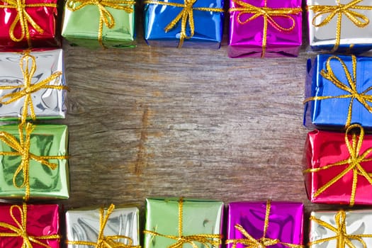 Frame made from many colorful glossy gift boxes