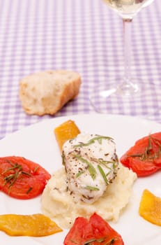 Roasted monkfish with pepper and rosemary on a plate