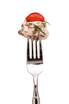 Monkfish with tomato,rosemary and caraway on a fork