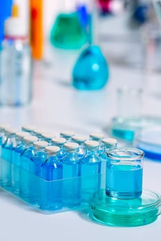 Chemical scientific laboratory stuff test tube and blue glass bottles