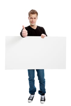 Casual young man holding a blank board