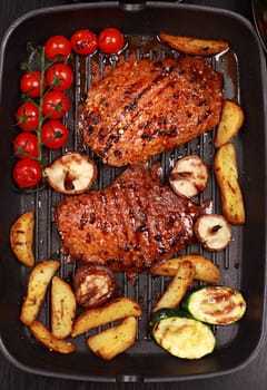 Delicious beef steak with grilled vegetable and mushrooms