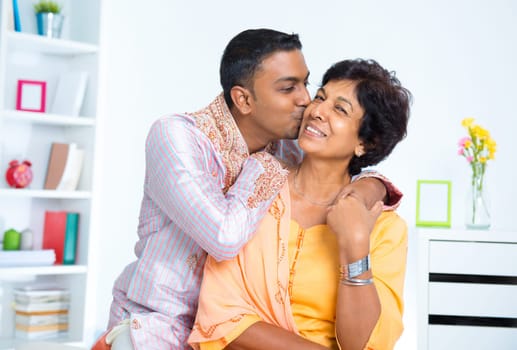Indian male kissing his mother, living lifestyle at home