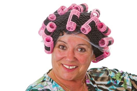 Senior woman with funny wig and curlers - isolated on white background