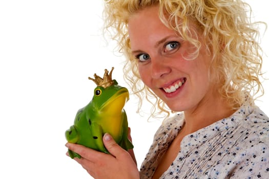 Young woman with frog prince isolated on white background