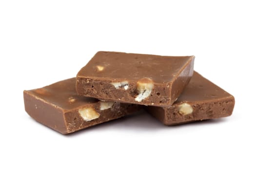 Chocolate,close-up of chocolate pieces against white background