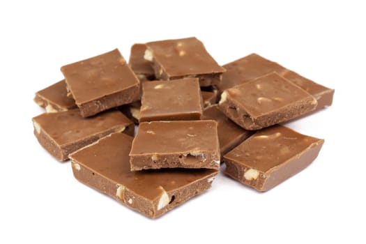 Chocolate,close-up of chocolate pieces against white background