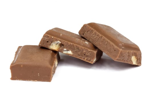 Chocolate,close-up of chocolate pieces against white background
