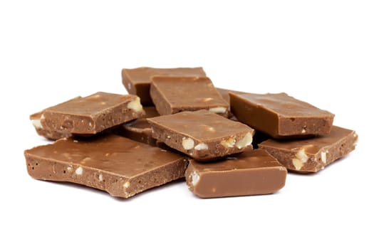 Chocolate,close-up of chocolate pieces against white background