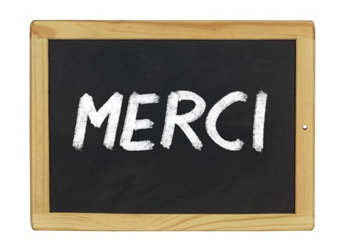 Merci written on a slate