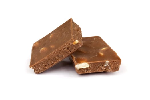 Chocolate,close-up of chocolate pieces against white background