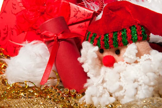 Santa Claus doll an christmas gift on a white background