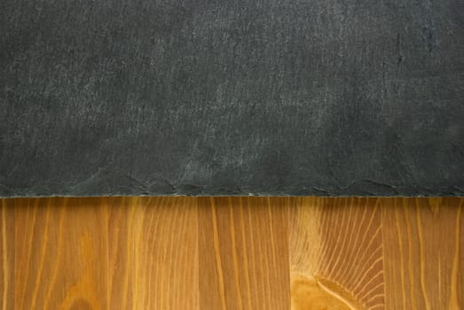 a slate and wooden background or texture, grey and brown