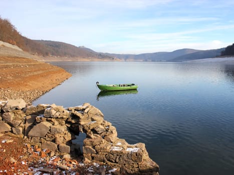 Green fishing boat at the surfaced Bericher Hütte