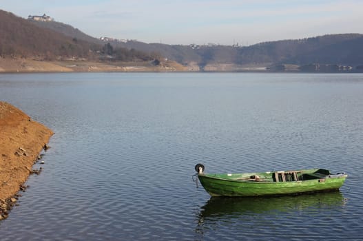 Green fishing boat at the surfaced Bericher Hütte