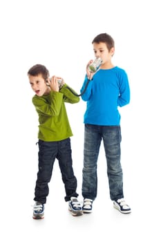 Two boys calling tin can phone. Studio shot.