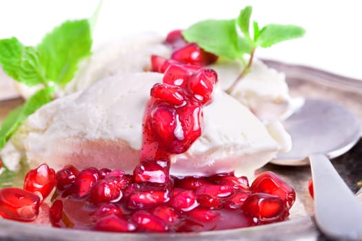 Vanilla ice cream with fruity red pomegranate