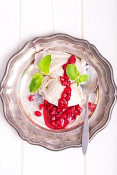 Vanilla ice cream with fruity red pomegranate