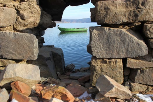 Green fishing boat at the surfaced Bericher Hütte
