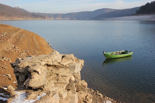 Green fishing boat at the surfaced Bericher Hütte