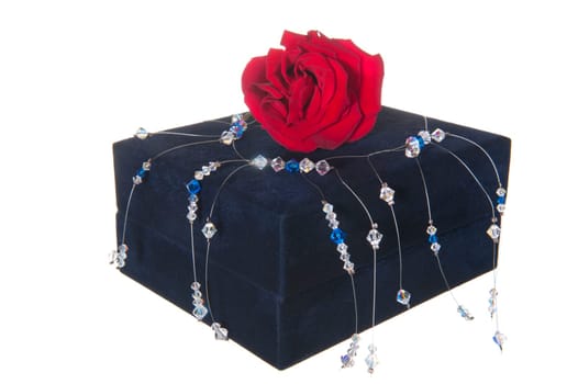 Gift box, pink and necklace on white background