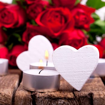 Wooden hearts with red roses