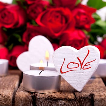 Wooden hearts with red roses