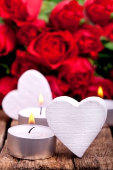 Wooden hearts with red roses