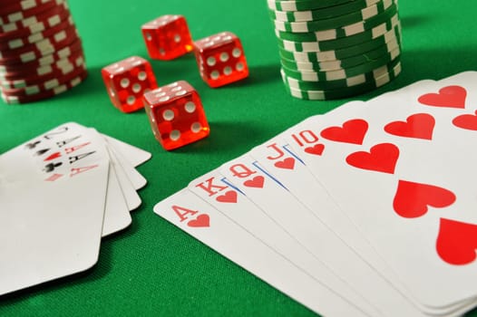 Composition with playing cards on green table