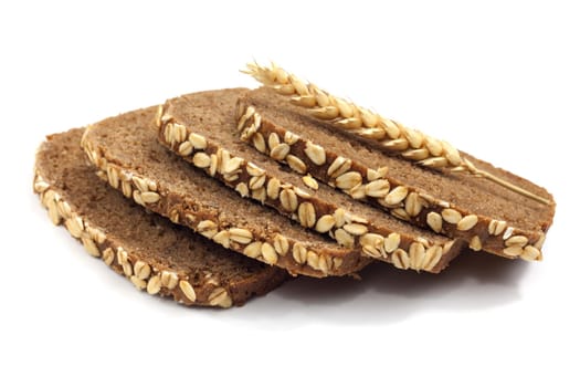 Wholemeal bread,slices against a white background